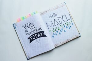 Open journal featuring 'Hello March' and an inspirational quote.